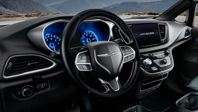 A 2026 Chrysler Voyager minivan in one of its four available exterior colors including Red Hot, Silver Mist, & Bright White.