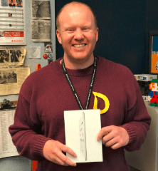 happy male teacher with new ipad