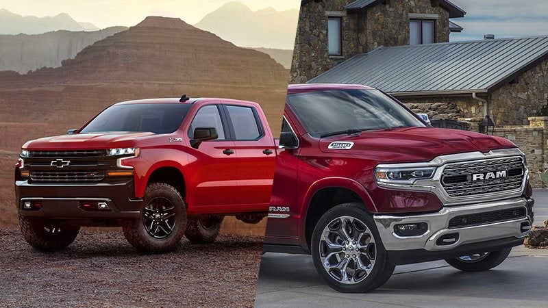 red chevy truck in desert and red ram truck in front of house