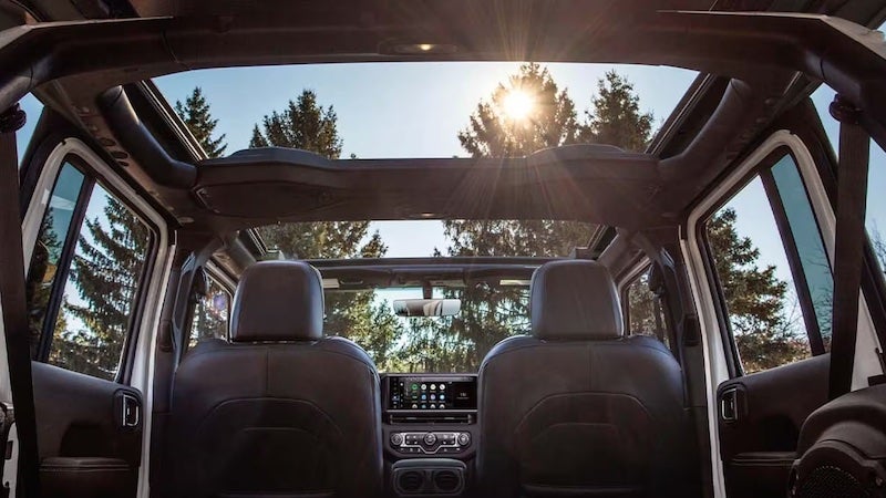 2026 Jeep Wrangler off-road SUV has the ability to have its doors removed, highlighting its open-air and rugged capability.
